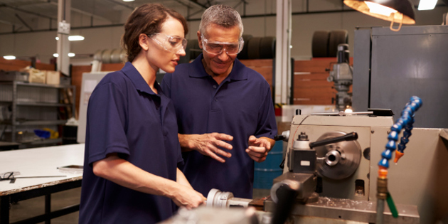 Engineer Training Female Apprentice On Milling