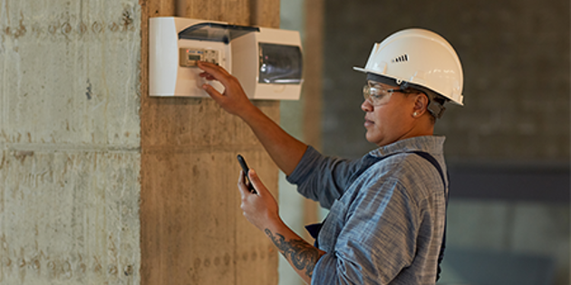 Electrician testing a main switch