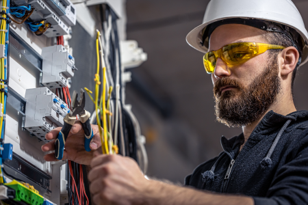 Electrician repairing power box