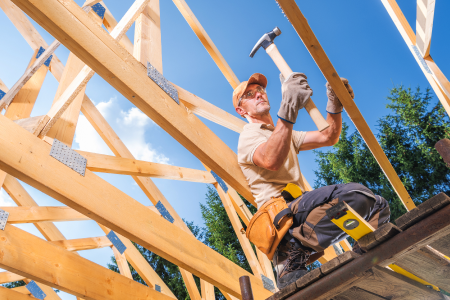 carpenter building house frame