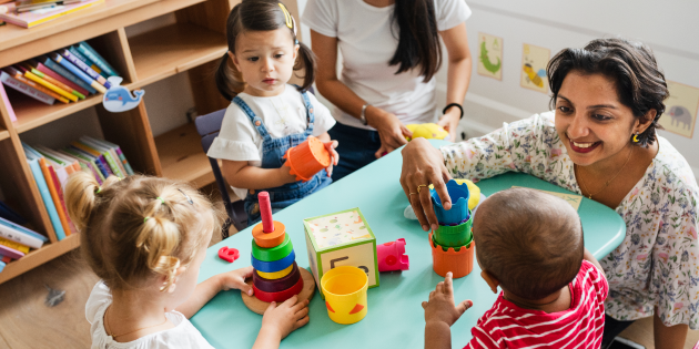 Children playing with stacking toys
