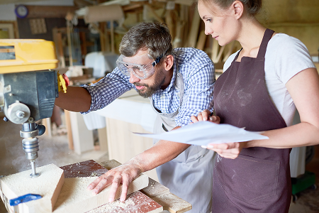 Apprentice learning how to use drill