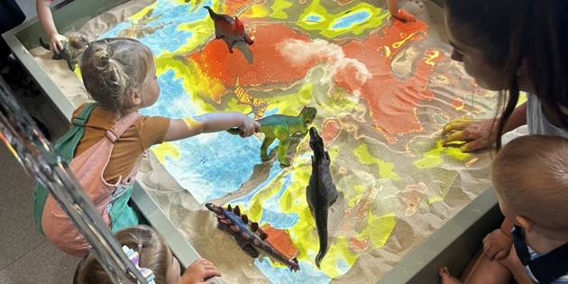 Dinosaur sand pit with projector