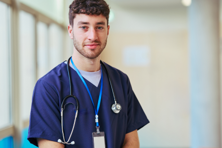 Nursing student standing in corridor