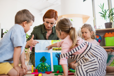 Preschool children playing with painting
